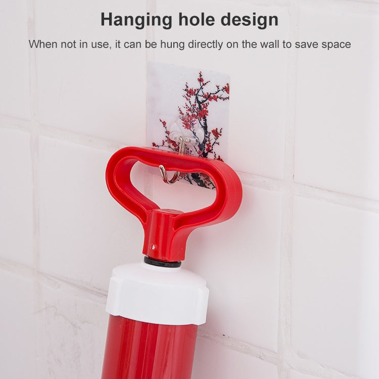 Red toilet suction cup vacuum pump with hanging loop for wall storage