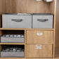 Square non-woven storage boxes, gray fabric with carry handles on shelving