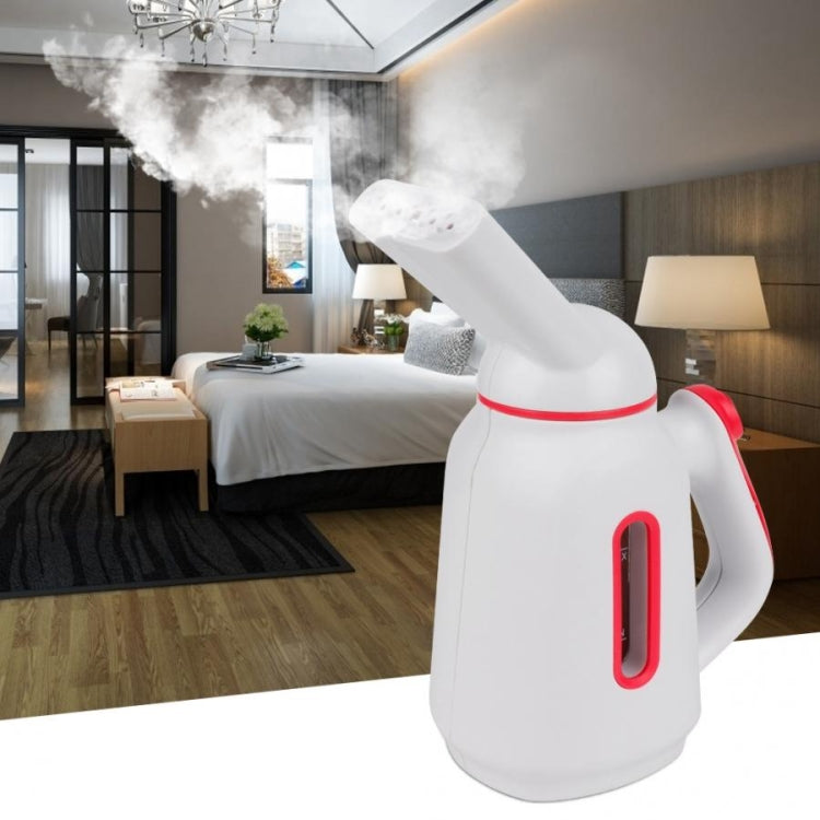 Mini handheld garment steamer in white with red handle accents and steam nozzle