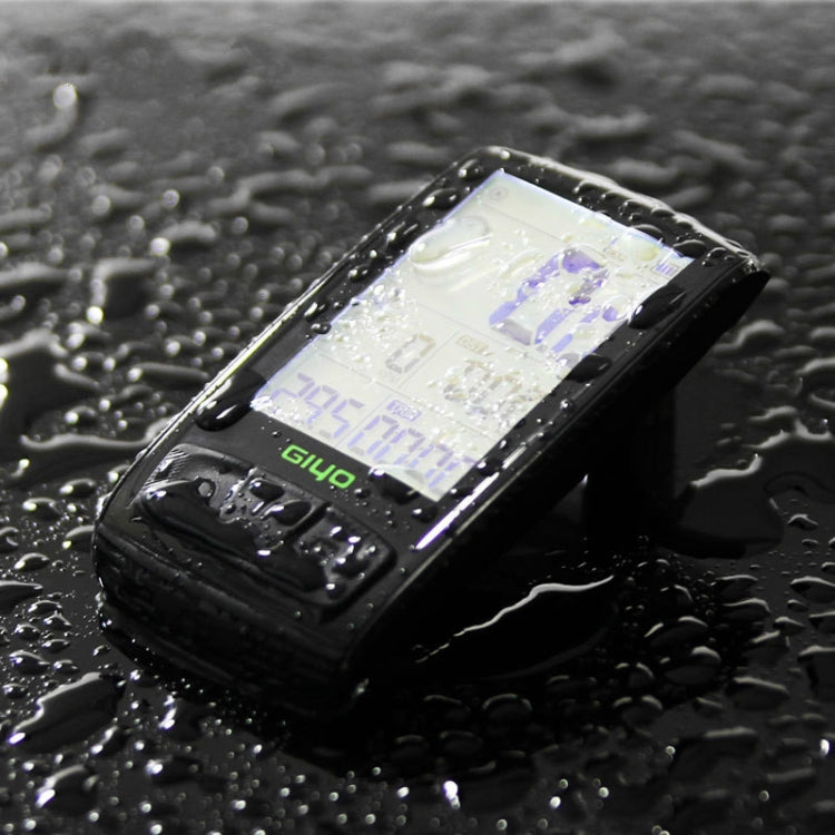 Waterproof black GIYO M4 bicycle computer with LCD display on wet surface