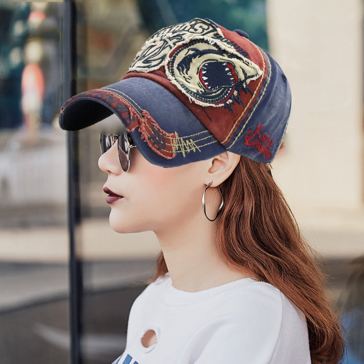 Denim and red baseball cap with embroidered shark patch and stitched brim trim
