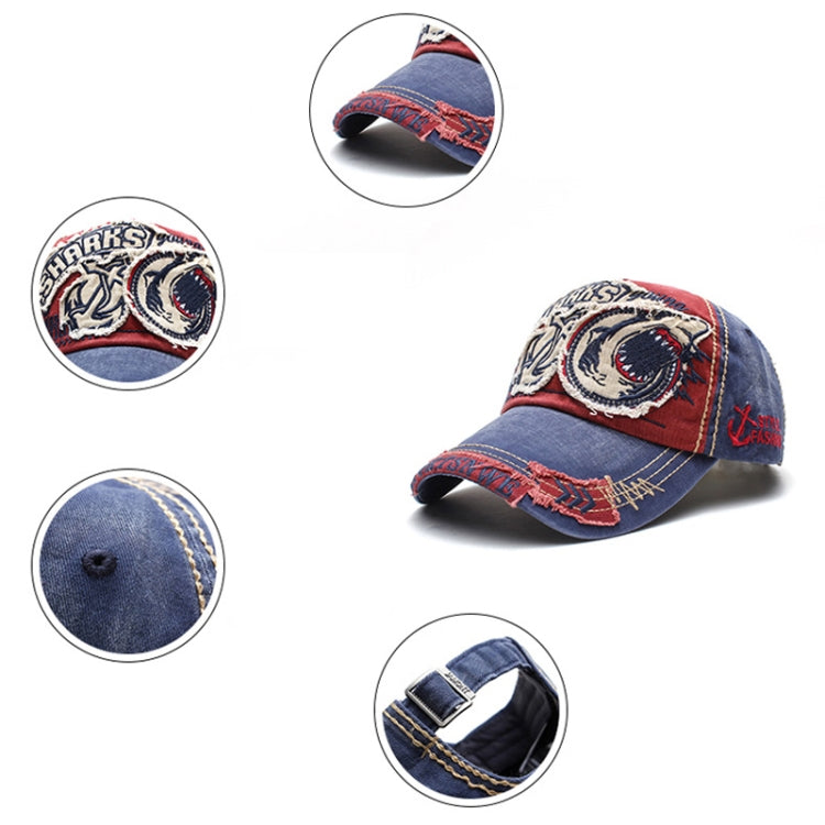 Denim baseball cap with shark patch and red underbrim detail, adjustable strap.