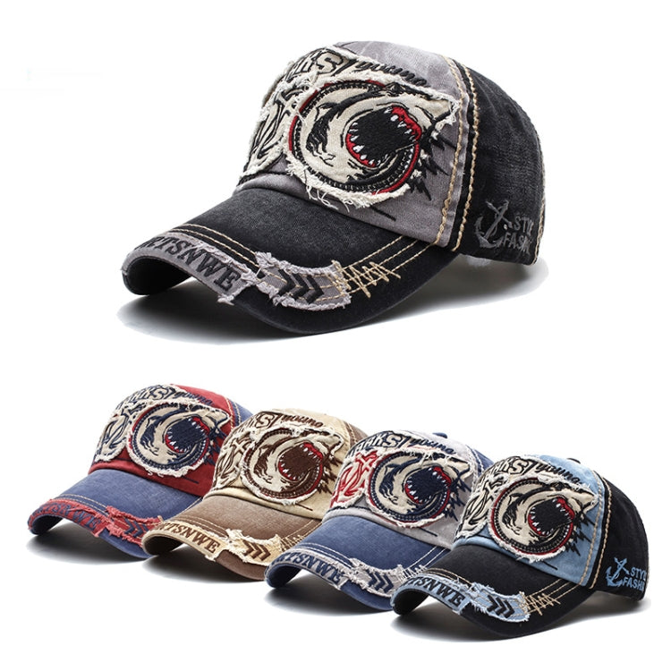 Light gray baseball cap with large shark patch, dark brim, and embroidered accents.