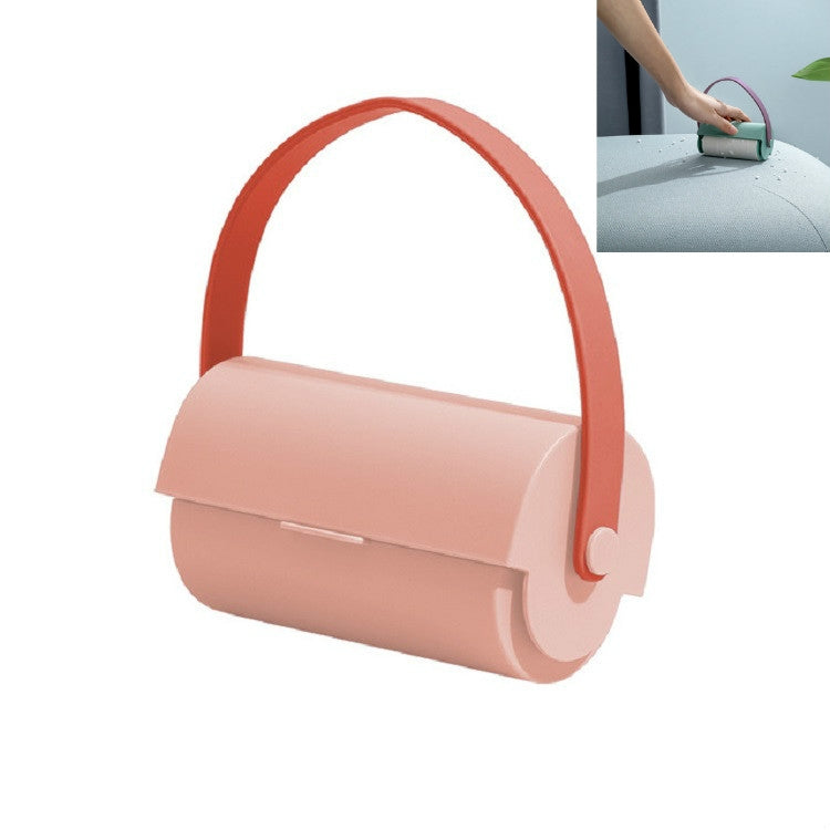 Handheld sticky lint roller with peach body and coral handle ring