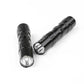 Black mini flashlight duo with front lenses visible and ridged body sections