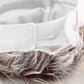 Close-up of skullcap wig hat: white lining panel and gray faux hair