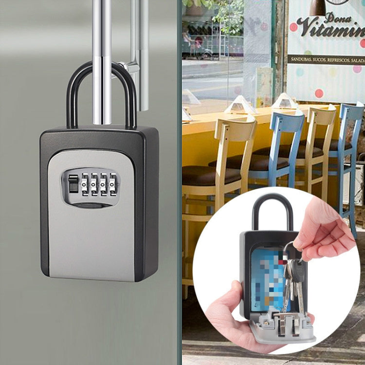 Grey key password lock box with keypad and shackle, with hand placing a key