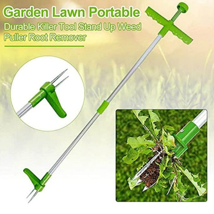Green weed puller with long silver shaft, cross handle grip, and three prongs at tip