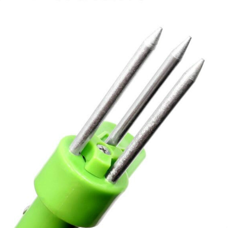 Green tool head with three pointed metal prongs for weed pulling
