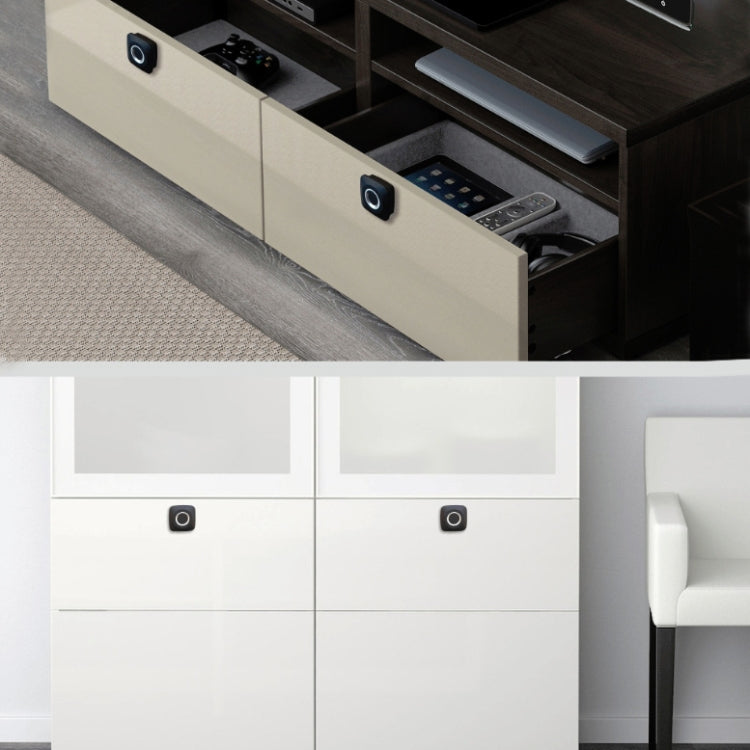 Fingerprint drawer lock with black sensor circle on light cabinet drawer front