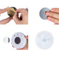 Round LED night light with hand-held battery install and underside button view