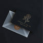 Black greeting card with gold rose design and “ESPECIALLY FOR YOU” text, with light envelope