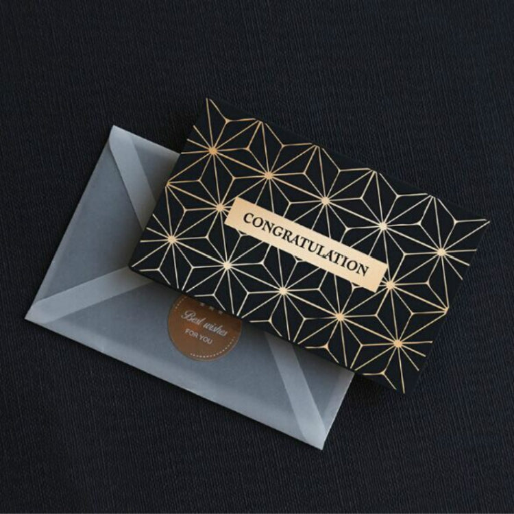 Black greeting card with gold geometric star pattern and “CONGRATULATION”, with envelope