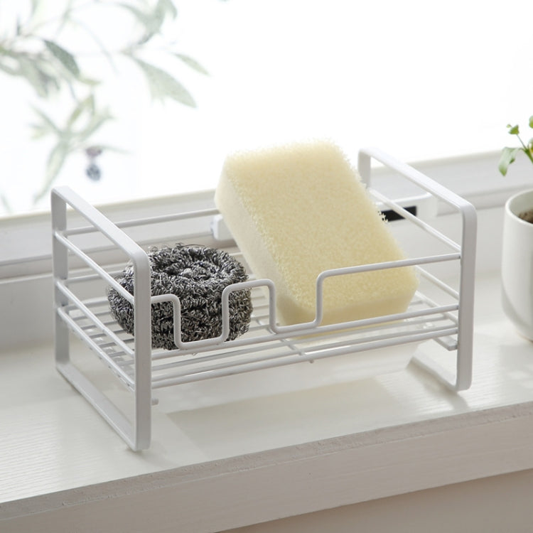 White metal dish drain rack with sponge and scrubber holders on a slotted base