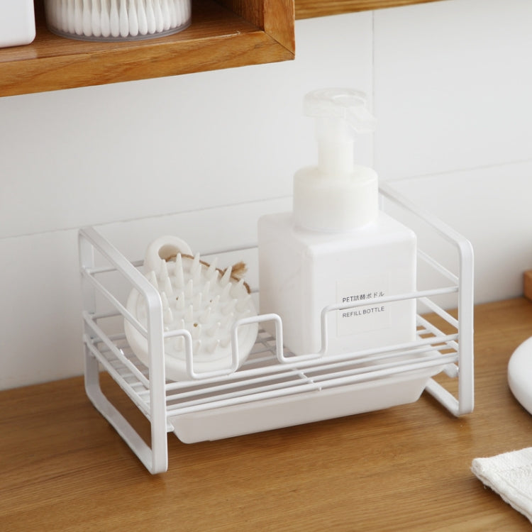 White metal dish drain rack with soap dispenser and brush holders on slatted base