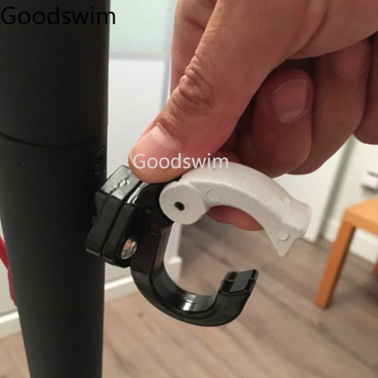 Aluminum hanging bag hook being mounted on a scooter handlebar, black and silver