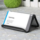 Black metal mesh business card holder holding a white business card