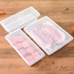 Clear plastic freezer boxes with pink and pale meat, ribbed divider shelves