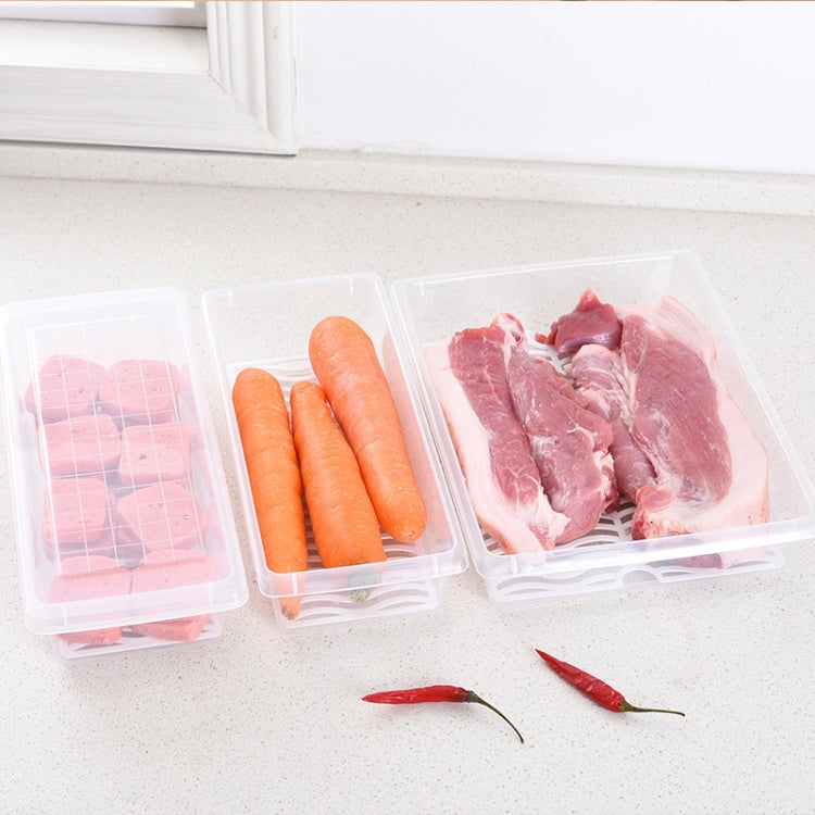 Clear plastic storage boxes with carrots and raw meat, sealed for freezing