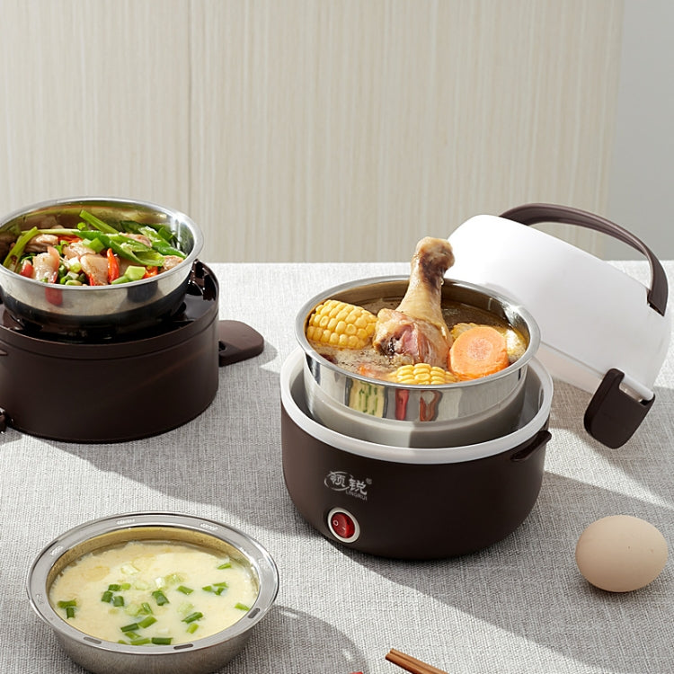 Brown electric lunch box with steaming stainless pot and sliced vegetables and eggs