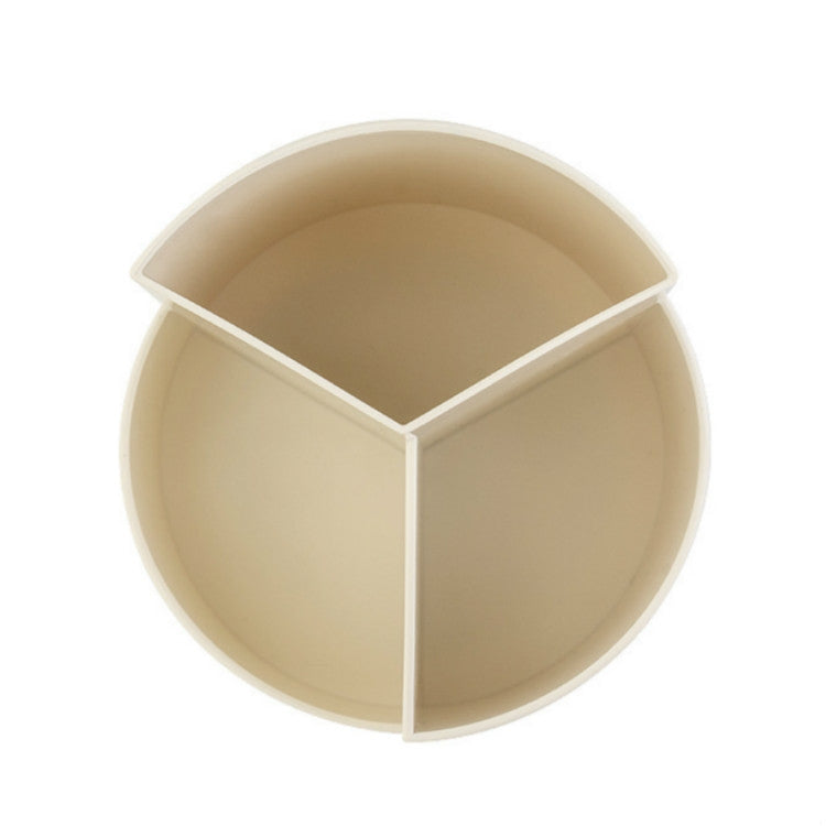 Round rotating pen holder interior with four equal compartments for stationery.