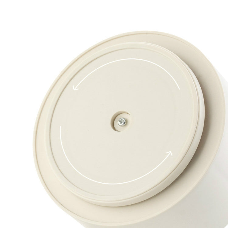 Rotating pen holder lid with central screw on round white base.