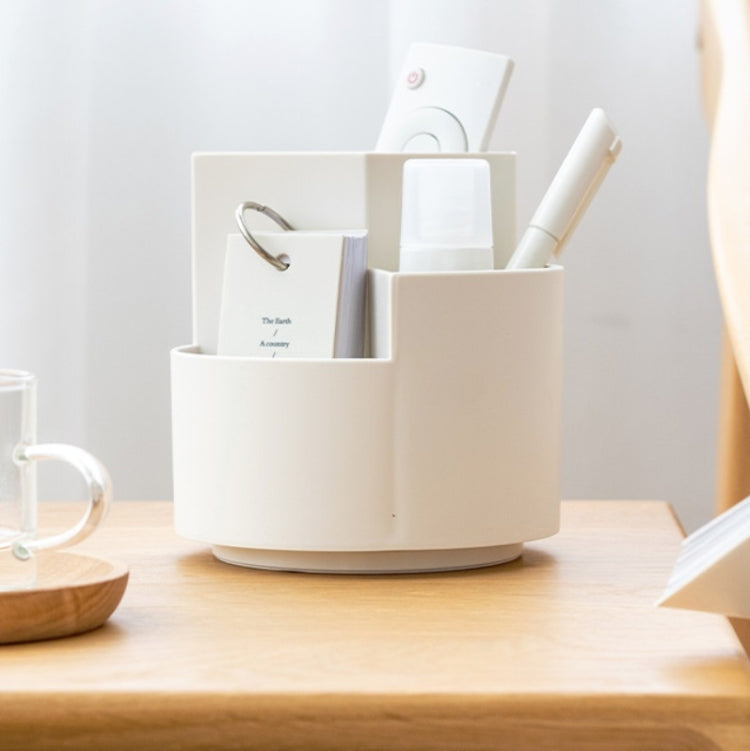 Rotating desk pen holder with multiple slots holding pens, markers, and notes.