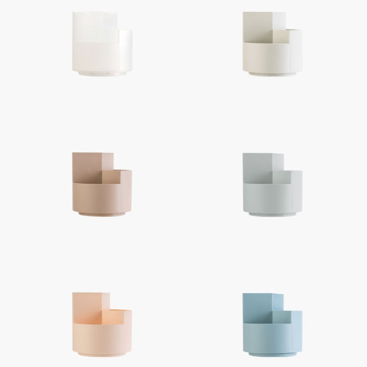Set of rotating pen holders in different colors: white, gray, blue, and beige.