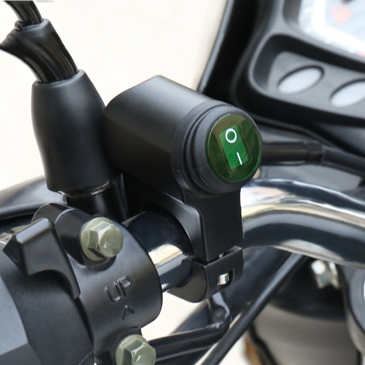 Motorcycle LED waterproof switch near handlebars, green indicator on black housing