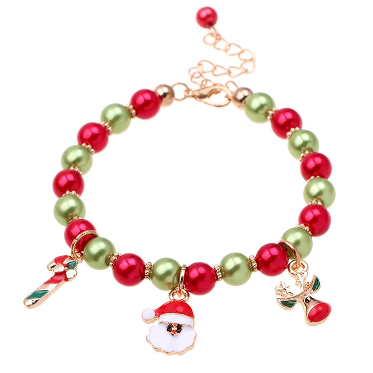 Beaded Christmas charm bracelet with red and green beads, Santa face and reindeer charms