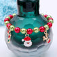 Beaded Christmas charm bracelet with red and green beads, Santa face and reindeer charms