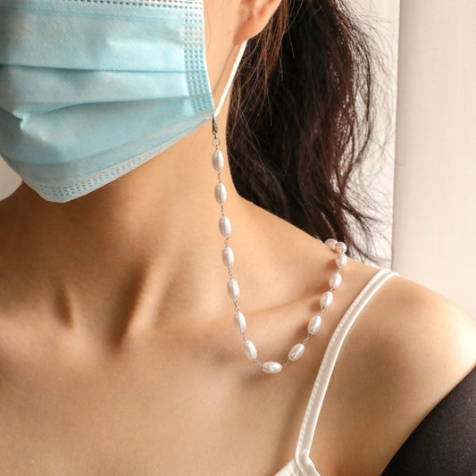 Oval pearl lanyard necklace worn on neck with blue face mask