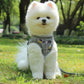 Gray plaid pet chest leash vest with reflective trim and traction rope on small dog