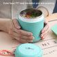 Teal stainless steel soup cup thermos held in hands with round lid