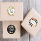Thank you seal stickers with floral and striped round designs on kraft gift boxes