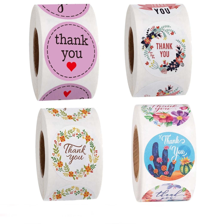 Set of thank you roll sticker labels with purple and floral designs, pictured together