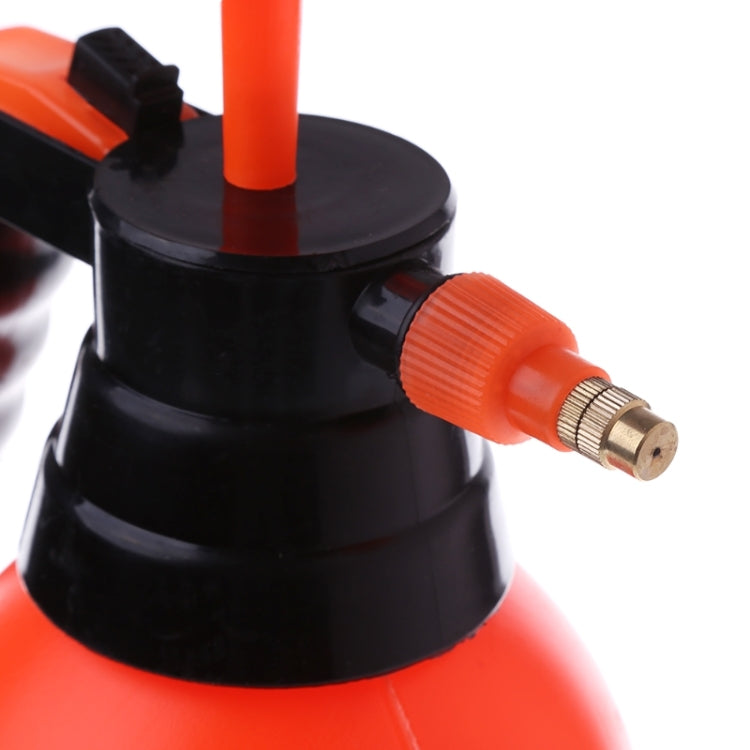 Orange sprayer nozzle with brass connector on black cap