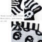 Close-up of black-and-white striped knit pet sweater details