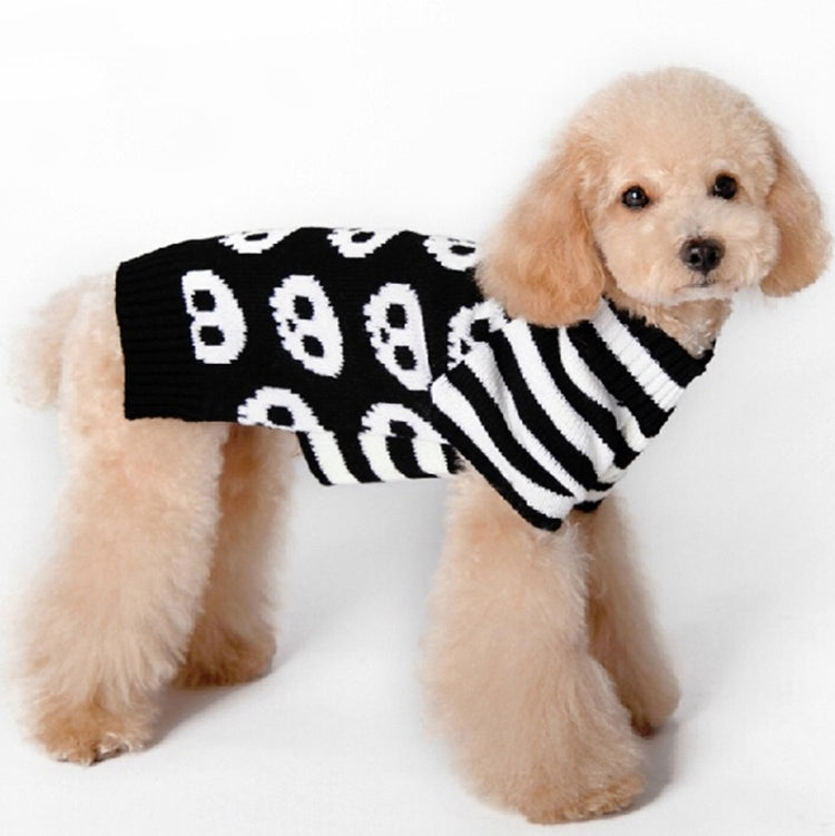 Dog wearing skull pet sweater, black knit with white skulls and striped collar