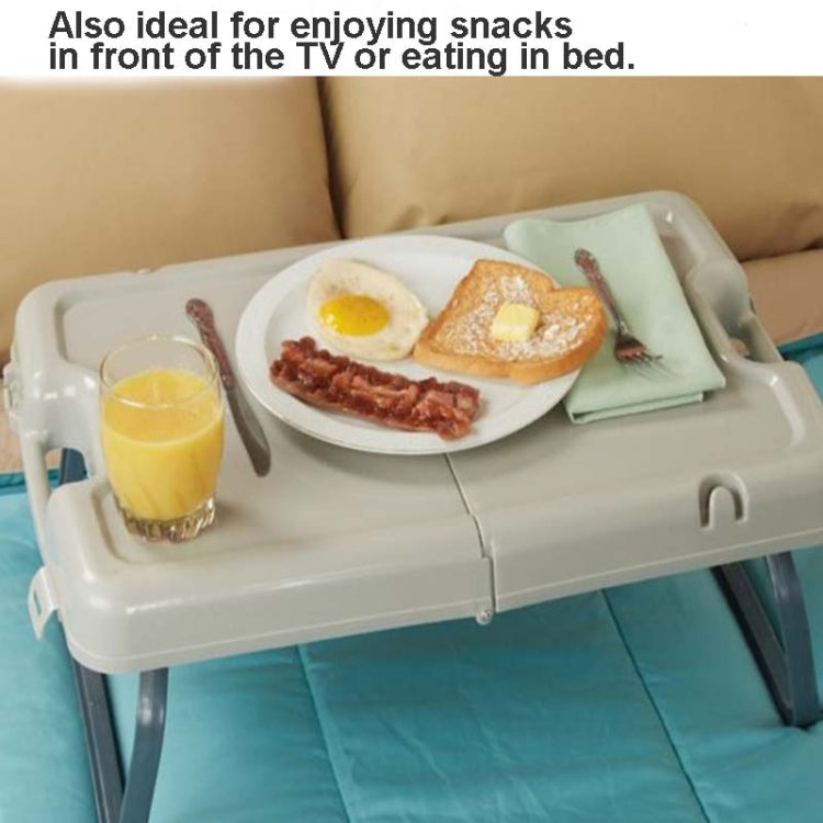 Light gray serving table with extended legs holding breakfast plate and drinks