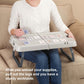 Folding lap table with extended legs, light gray top holding a deck of cards