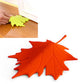 Red-orange maple-leaf finger safety door stop stopper with raised leaf texture
