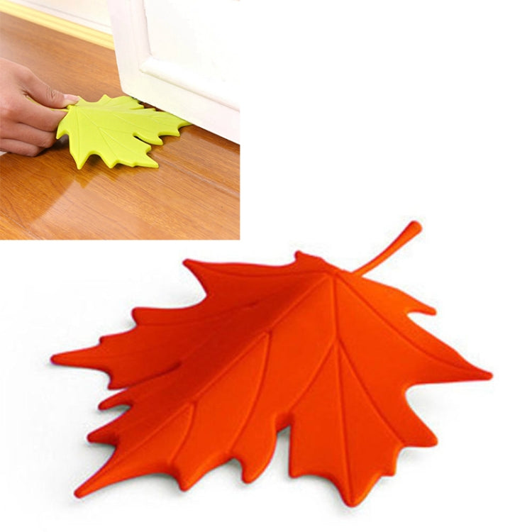 Red-orange maple-leaf finger safety door stop stopper with raised leaf texture