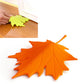 Orange maple-leaf finger safety door stop with stem and raised leaf lines