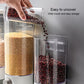Wall-mounted grain storage tank with clear body and wide fill opening, pouring beans