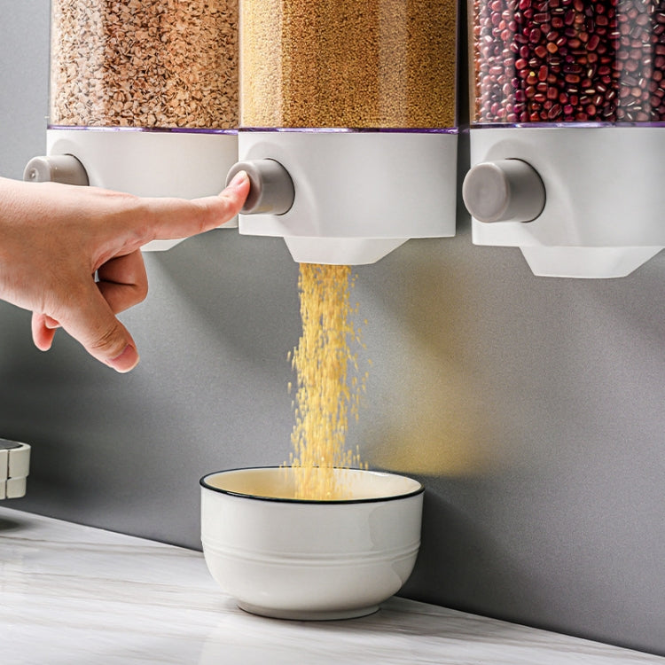 Wall-mounted grain storage tanks dispensing dry grains into a kitchen bowl