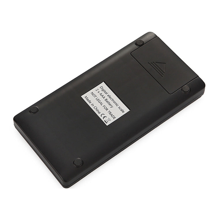 Black electronic scale base with label and non-slip feet underside view
