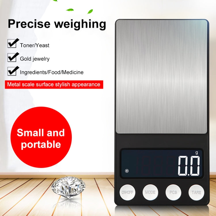 Compact electronic scale with brushed platform and buttons on black base