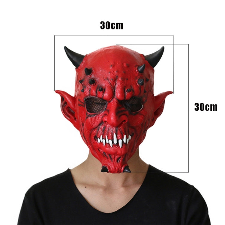Red horned demon latex mask on face with snarling expression and white teeth