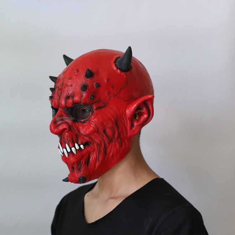 Red horned demon latex mask side profile with open mouth and white teeth